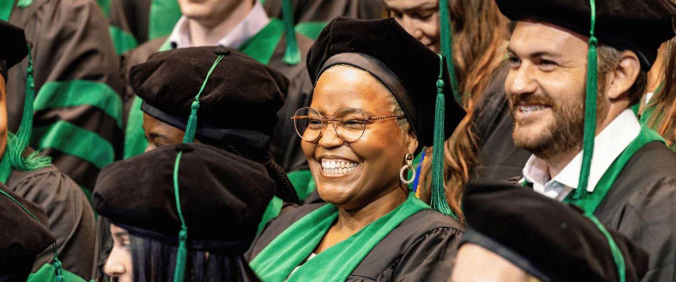 two medical students at graduation